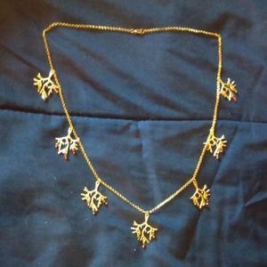 Goldtone Anthropologie coral motif necklace